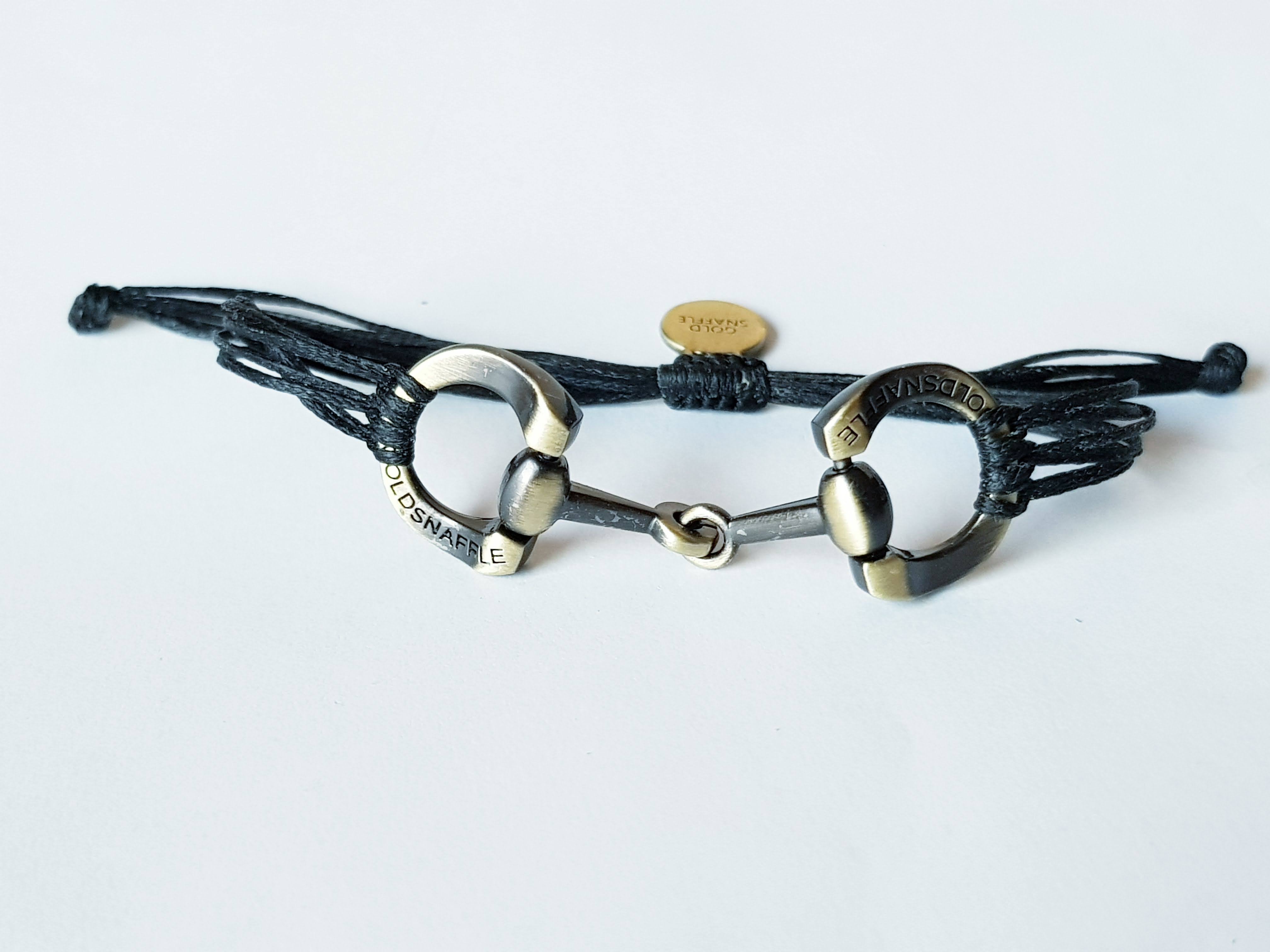 Brushed gold horse bit snaffle bracelet in leather string
