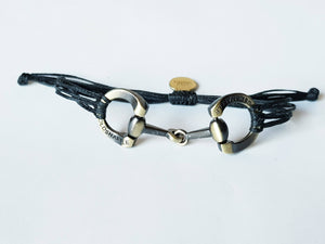 Brushed gold horse bit snaffle bracelet in leather string