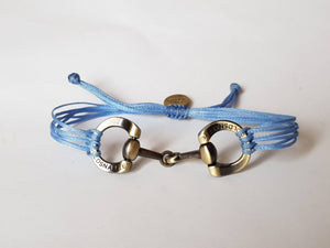 Brushed gold horse bit snaffle bracelet in leather string