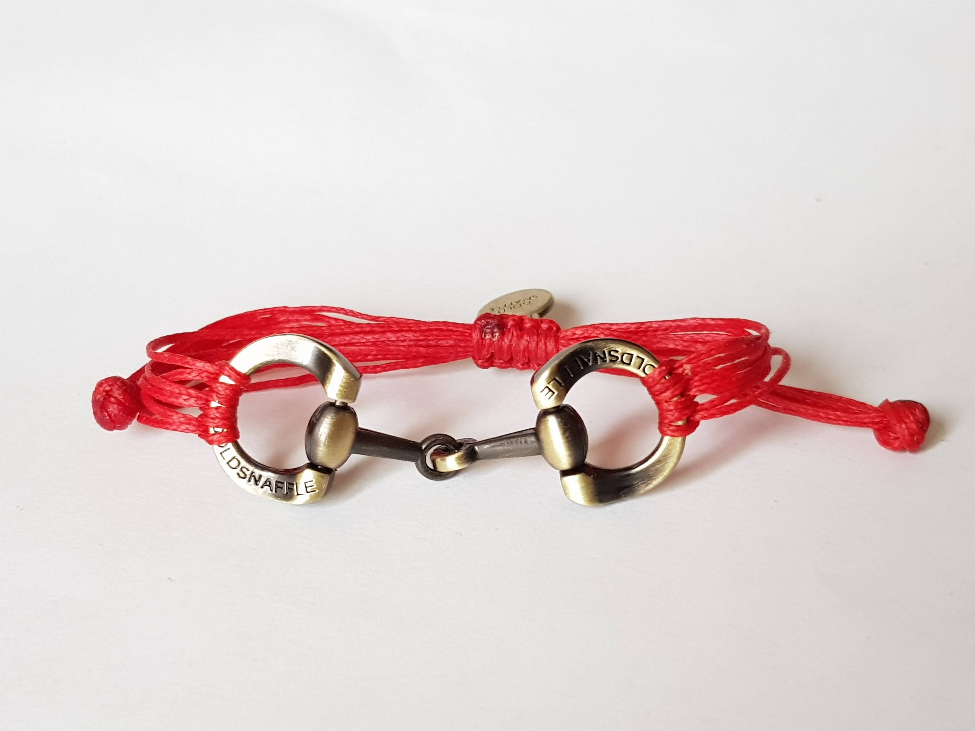 Brushed gold horse bit snaffle bracelet in leather string