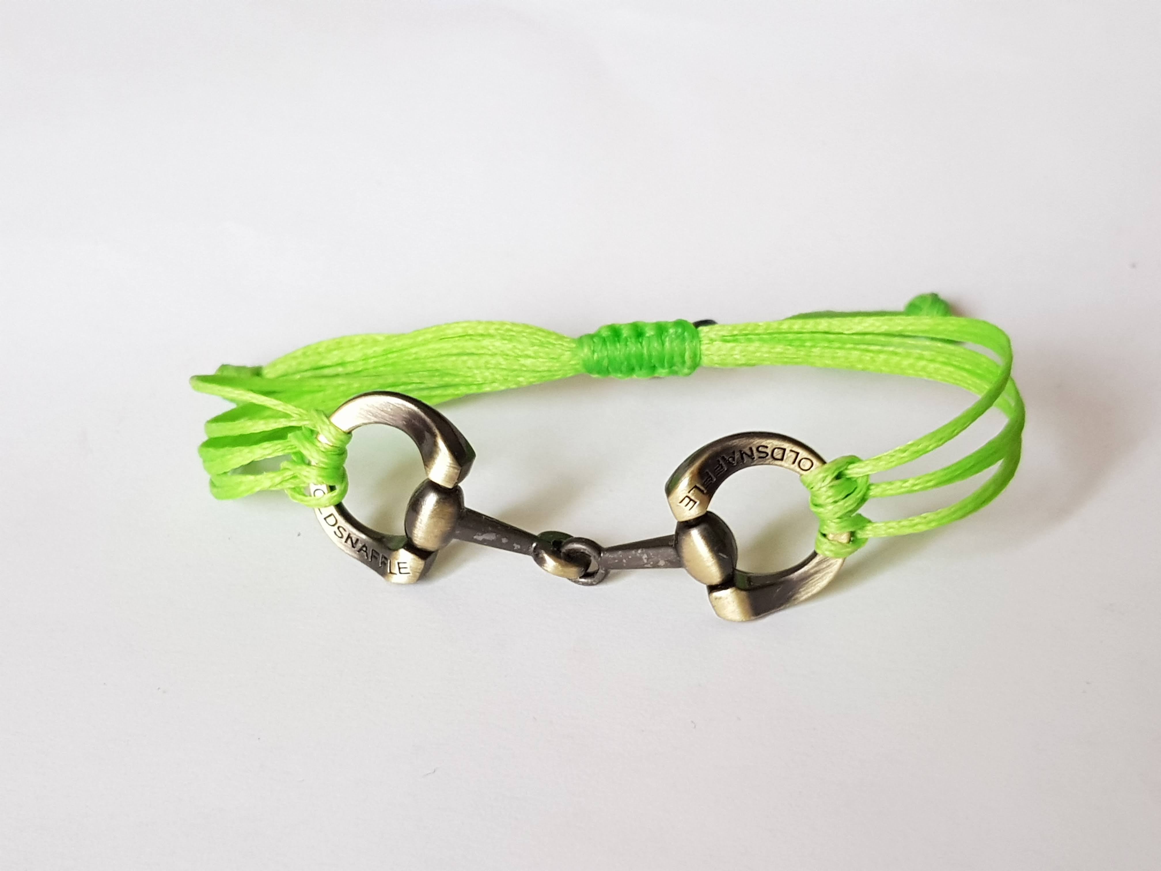 Brushed gold horse bit snaffle bracelet in leather string