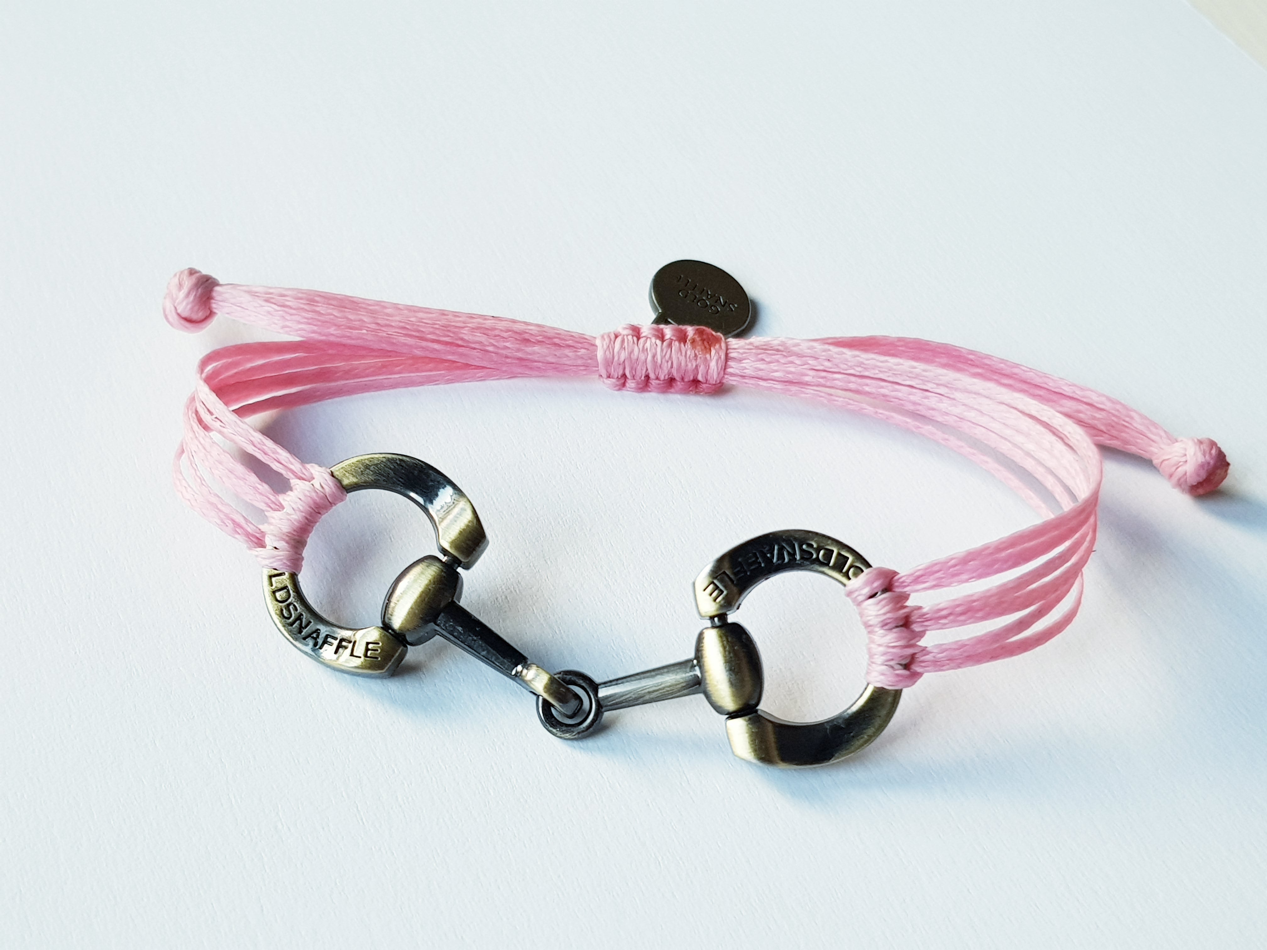 Brushed gold horse bit snaffle bracelet in leather string
