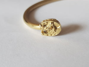 Horseshoe and horse heads bangle