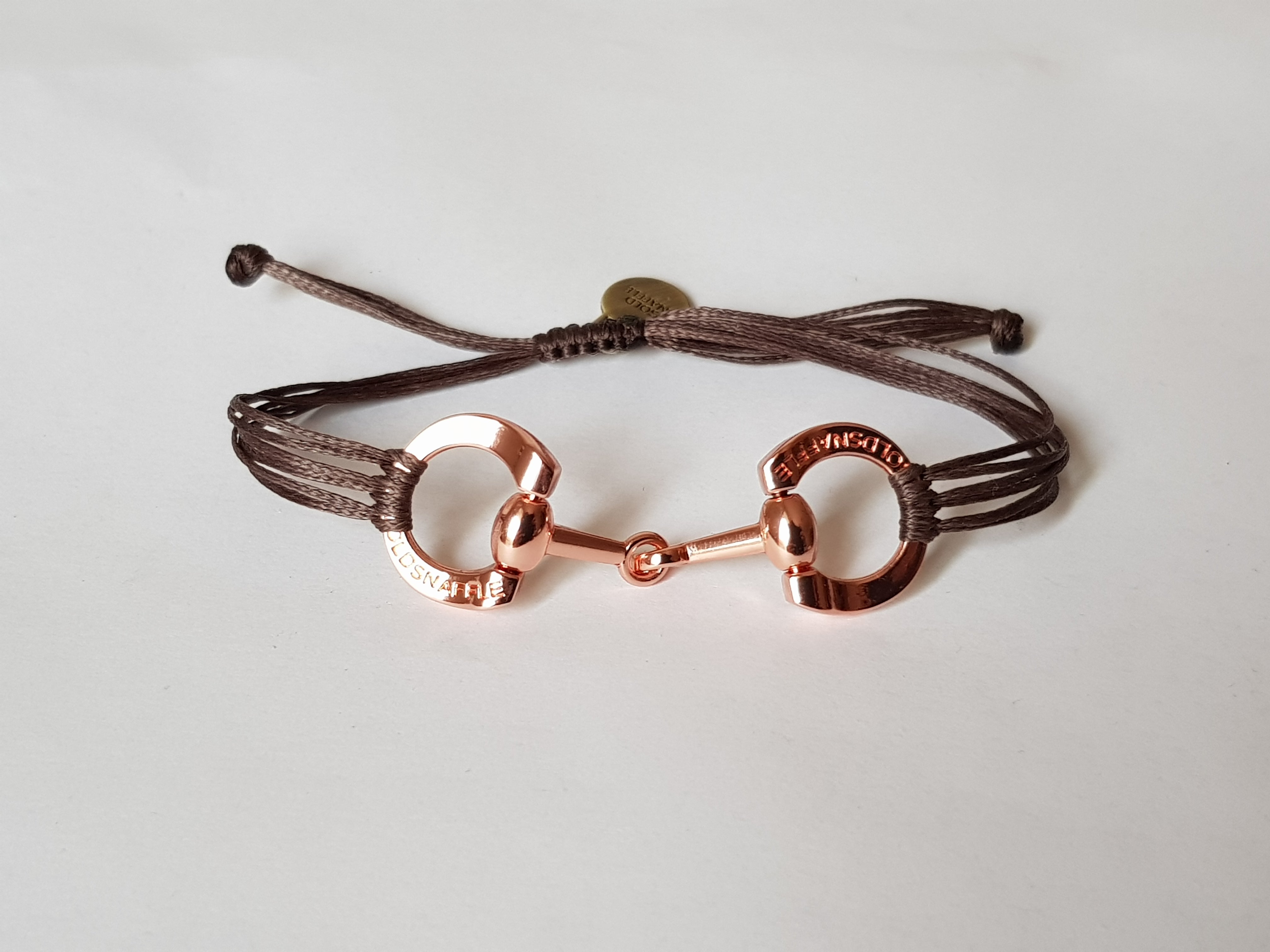 Rose gold horse bit snaffle bracelet in leather string