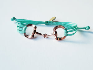 Rose gold horse bit snaffle bracelet in leather string