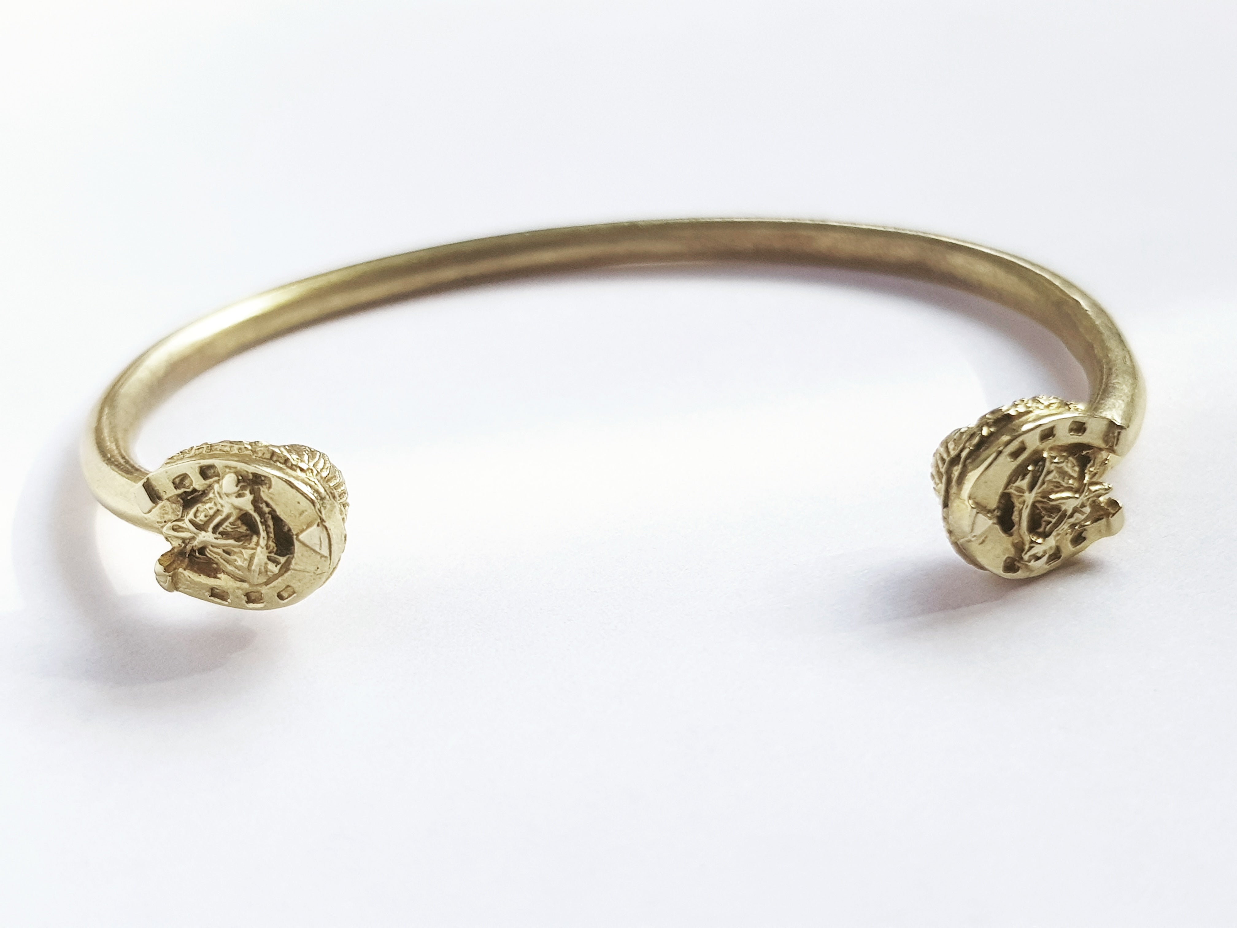 Horseshoe and horse heads bangle
